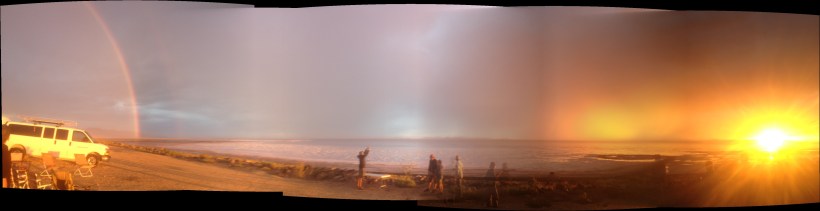 sunsetting to the west rainbow to the east